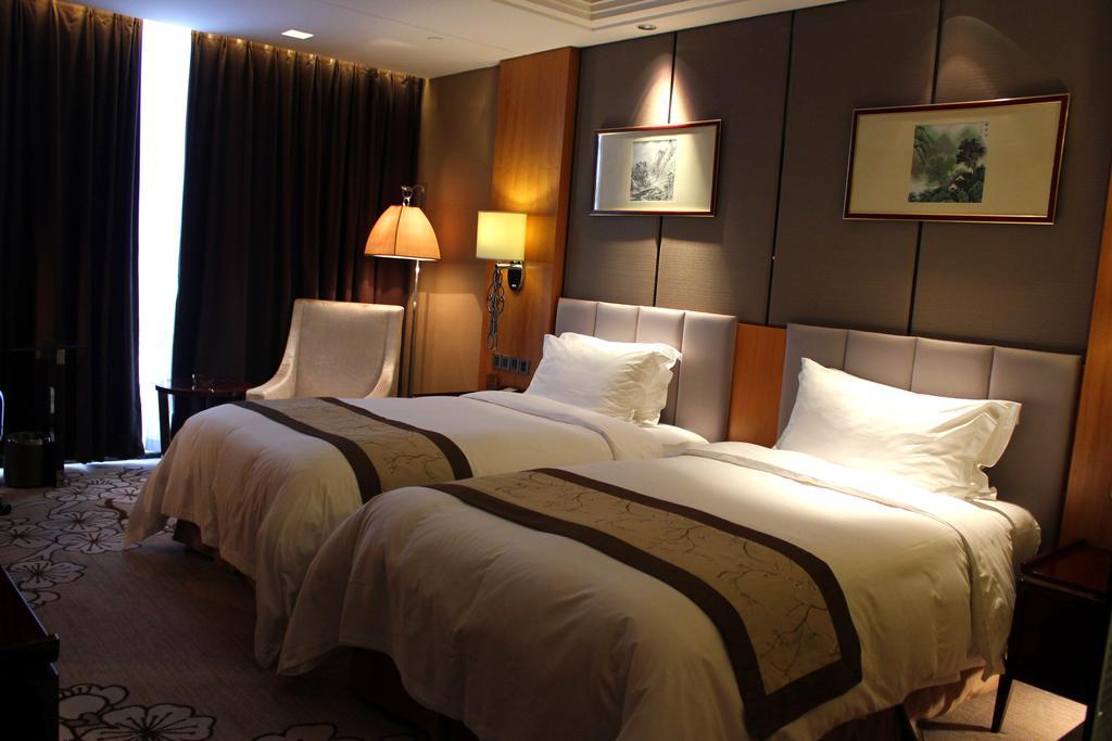 Zhangjiagang Zhonglian Gdh International Hotel Cameră foto